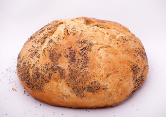 Large loaf of bread with poppy isolated on white