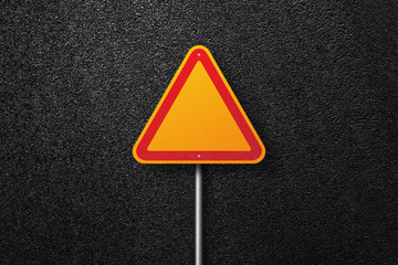 Road signs of the triangular shape on a background of asphalt. The texture of the tarmac, top view.