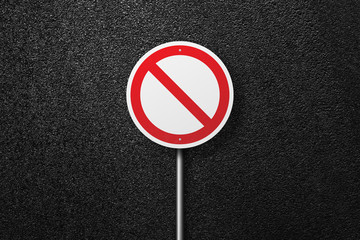 Road sign of the circular shape on a background of asphalt. The texture of the tarmac, top view.
