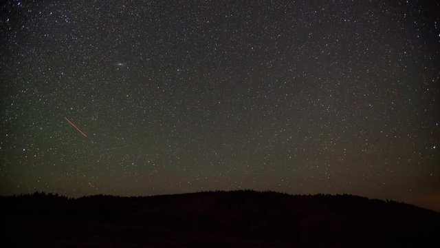 Nighttime time lapse of the stars moving across the sky as the moon rises. This was shot during the Perseid Meteor Shower, so on some frames you can see small shooting stars.