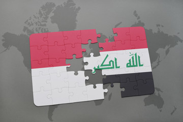 puzzle with the national flag of indonesia and iraq on a world map background.