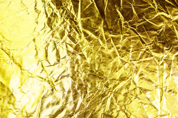 Gold background or texture and shadow. Gold fabric crease