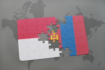 puzzle with the national flag of indonesia and mongolia on a world map background.