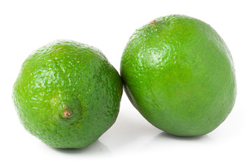 two lime isolated on white background close up