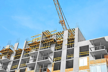 Crane and highrise construction site