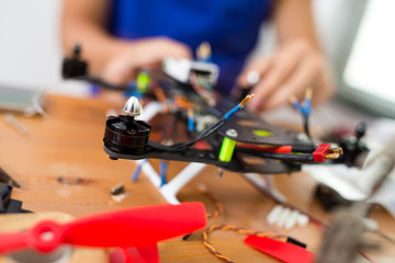 Man installing the component on drone body