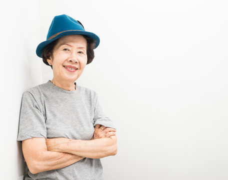 old women wear hat  smailling with text space
