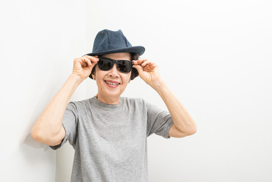 old women wear hat and sunglasses  smailling with text space