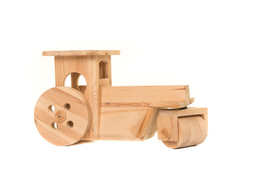 Wooden toy tractor car isolated on a white background