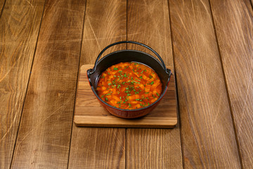 Soup on wooden background