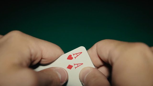 A pair of aces in a hand on the table. Pocker