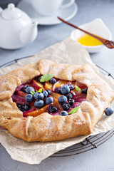 Rustic gallette pie with peaches and blueberry