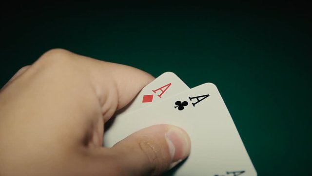 A pair of aces in a hand on the table. Pocker