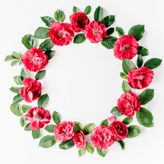 flat lay frame with red roses, branches, leaves and petals isolated on white background. top view