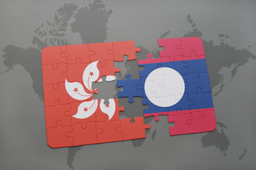 puzzle with the national flag of hong kong and laos on a world map background.