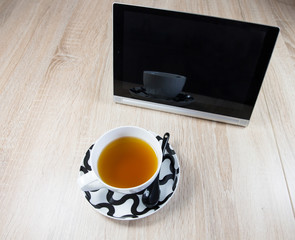 Tablet and a cup of tea