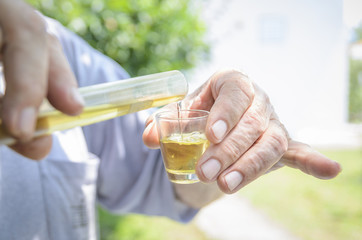 Gauging spirit in glass.