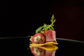 canapés for buffet on a black background
