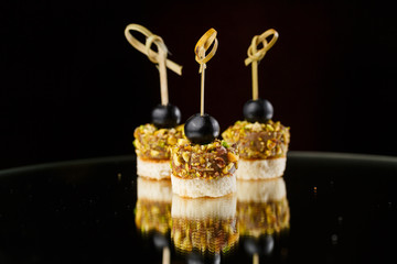 canapés for buffet on a black background
