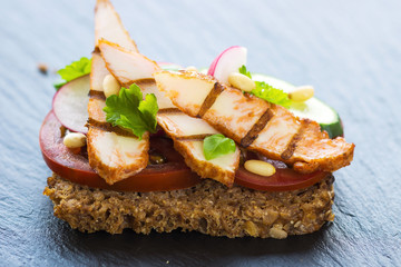 Delicious sandwich with grilled chicken and fresh crunchy vegetables