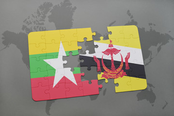 puzzle with the national flag of myanmar and brunei on a world map background.