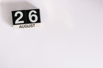 August 26th. Day 26 of month, wooden color calendar on white background. Summer time. Empty space for text