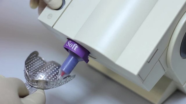 Material In Spoon To Remove Impression Of Bite