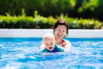 Mother and baby in swimming pool