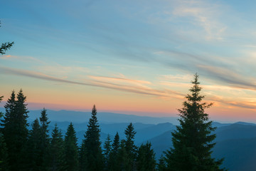 Naklejka na ściany i meble Sunset over the mountain ridge.