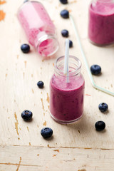 bilberry smoothie in glass small bottles