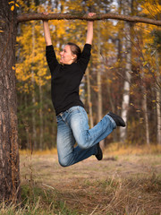 Adult woman hanging on a branch drawn in feet