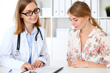 Doctor and  patient  sitting at the desk