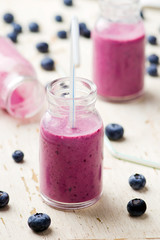 bilberry smoothie in glass small bottles