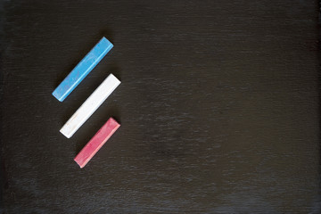 School supplies on a blackboard