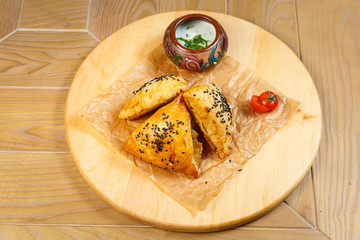 Baking and patties on a wooden background