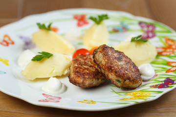 two patties with mashed potatoes