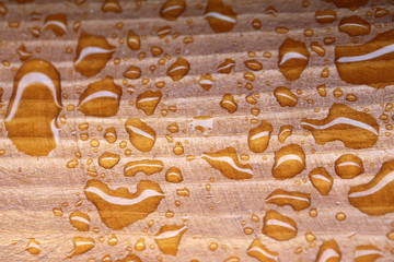 Drops on wooden background