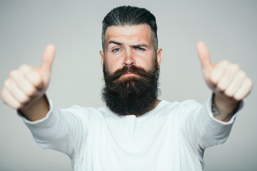 Naklejka premium Bearded man with super gesture