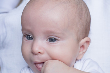 Baby biting its fingers 