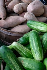 Fresh Picked Cucumbers and Sweet Potatoes at Farmers Market