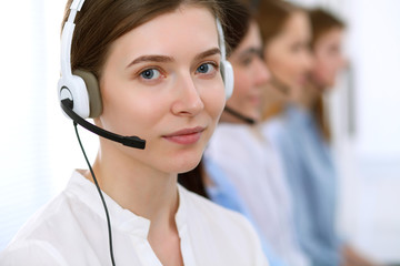 Call center operator.Young beautiful business woman in headset.