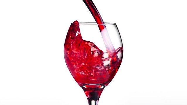 Wine being poured into a wine glass. Shoot with a high speed camera.