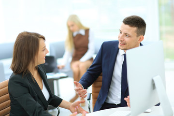 Business partners discussing n meeting hall