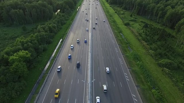 Aerial View of Traffic on a Motorway Ring Road Through a Wooded Area