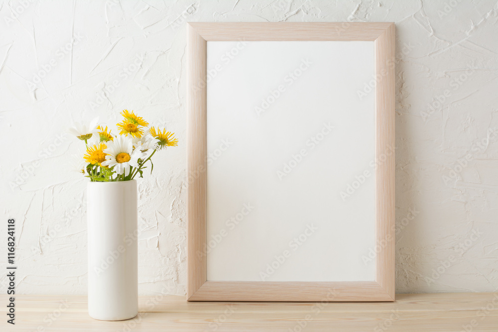 Wall mural frame mockup with white and yellow chamomiles in vase