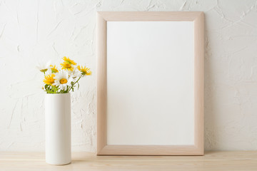 Frame mockup with white and yellow chamomiles in vase