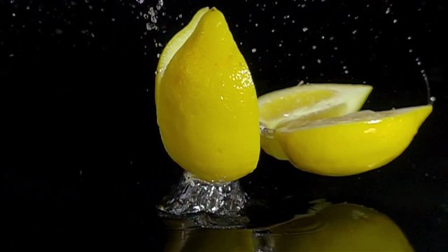 fruit mix composition montage falling splashing on black slow motion