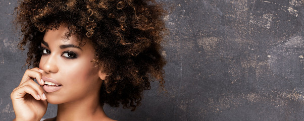 Portrait of young african girl with afro.