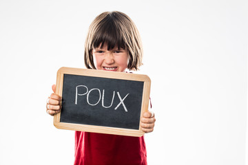 angry young child rejecting head lice from a school slate