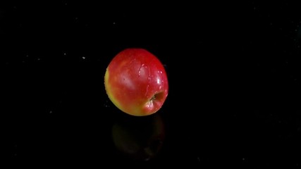 red apple splashing on water black background slow motion - Powered by Adobe